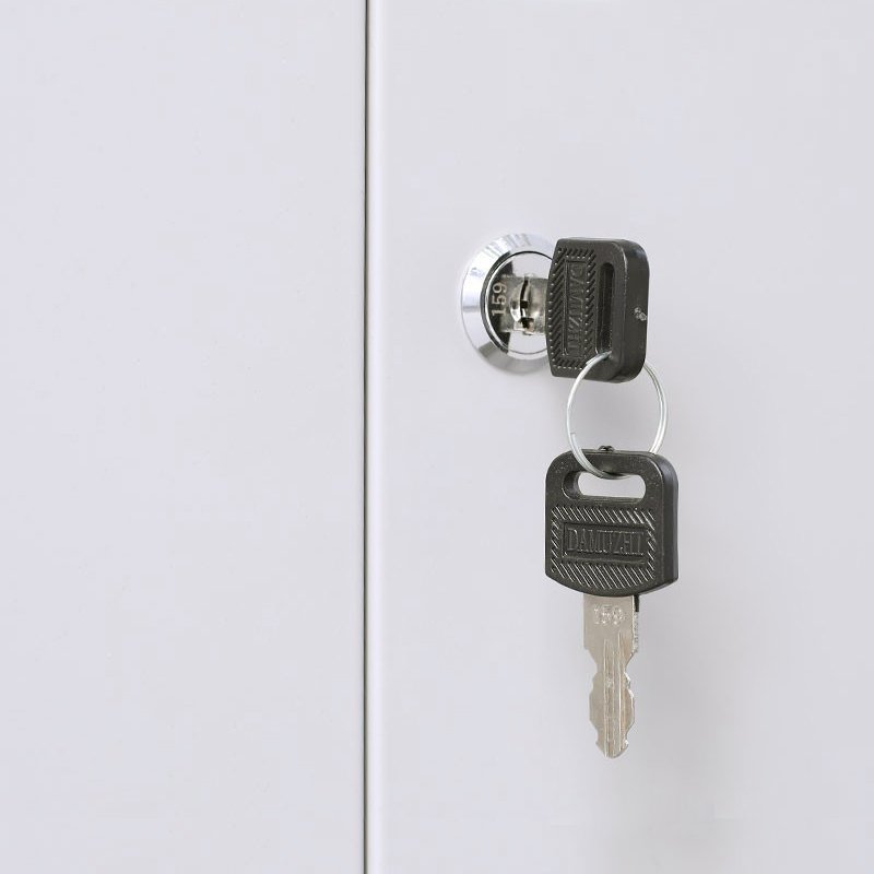 Key lock detail on a steel office storage cabinet